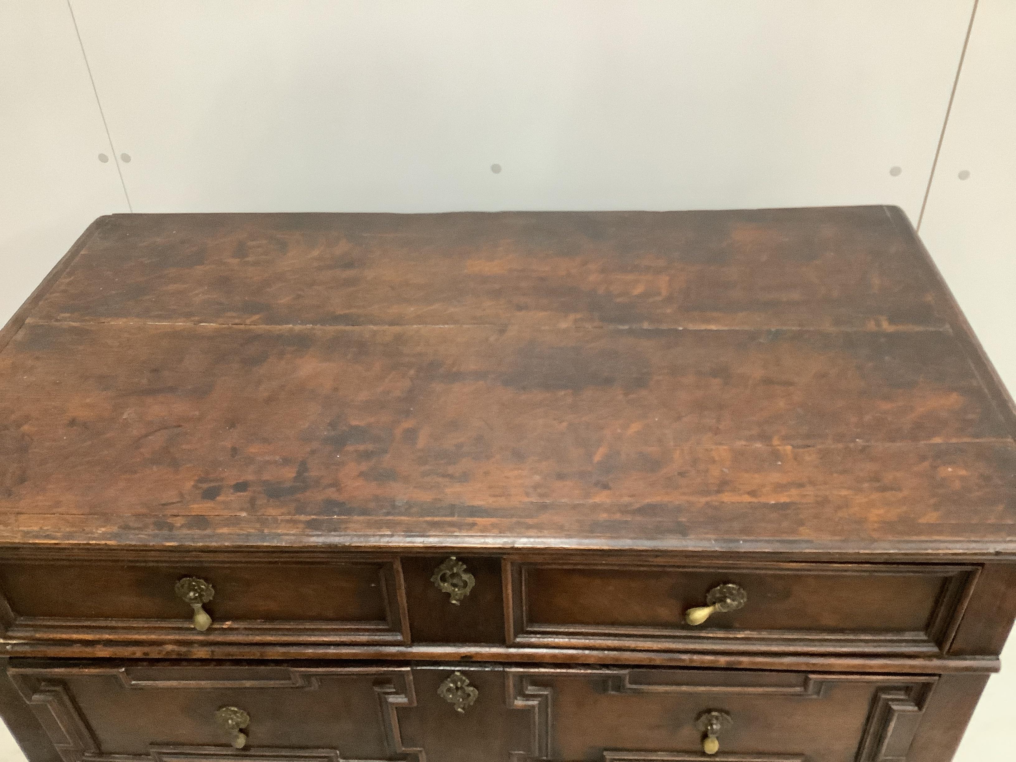 An early 18th century and later oak two part chest, width 96cm, depth 53cm, height 97cm